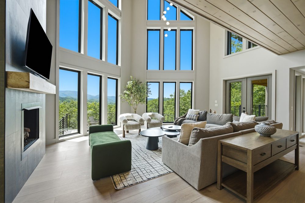 Great room with sectional and tall windows at 1813 Red Bone Way, Sevierville TN