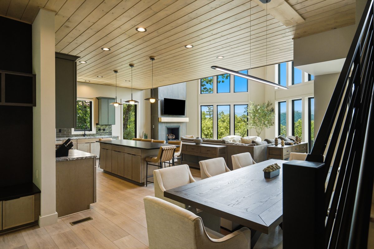 Open kitchen, dining, and living area with window wall at 1813 Red Bone Way, Sevierville TN