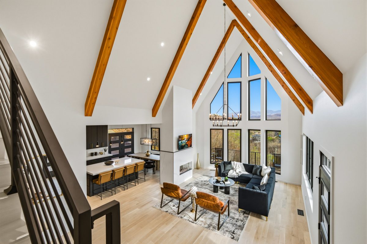 Vaulted great room with timber beams and mountain view window wall at 550 Greenbriar Ln, Gatlinburg TN