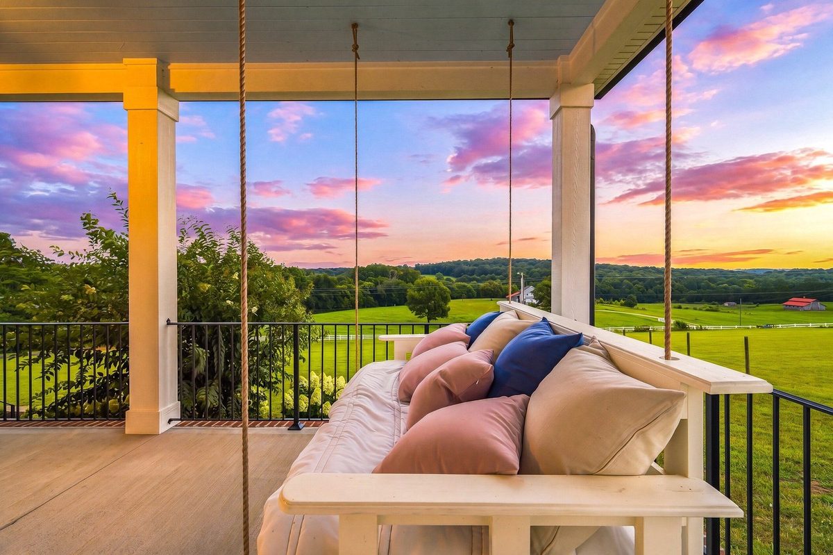 Farmhouse porch swing at twilight in Greenback, TN