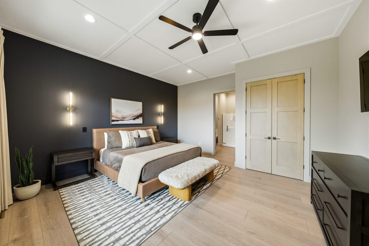 Bedroom with upholstered bed and dark accent wall at 1813 Red Bone Way, Sevierville TN