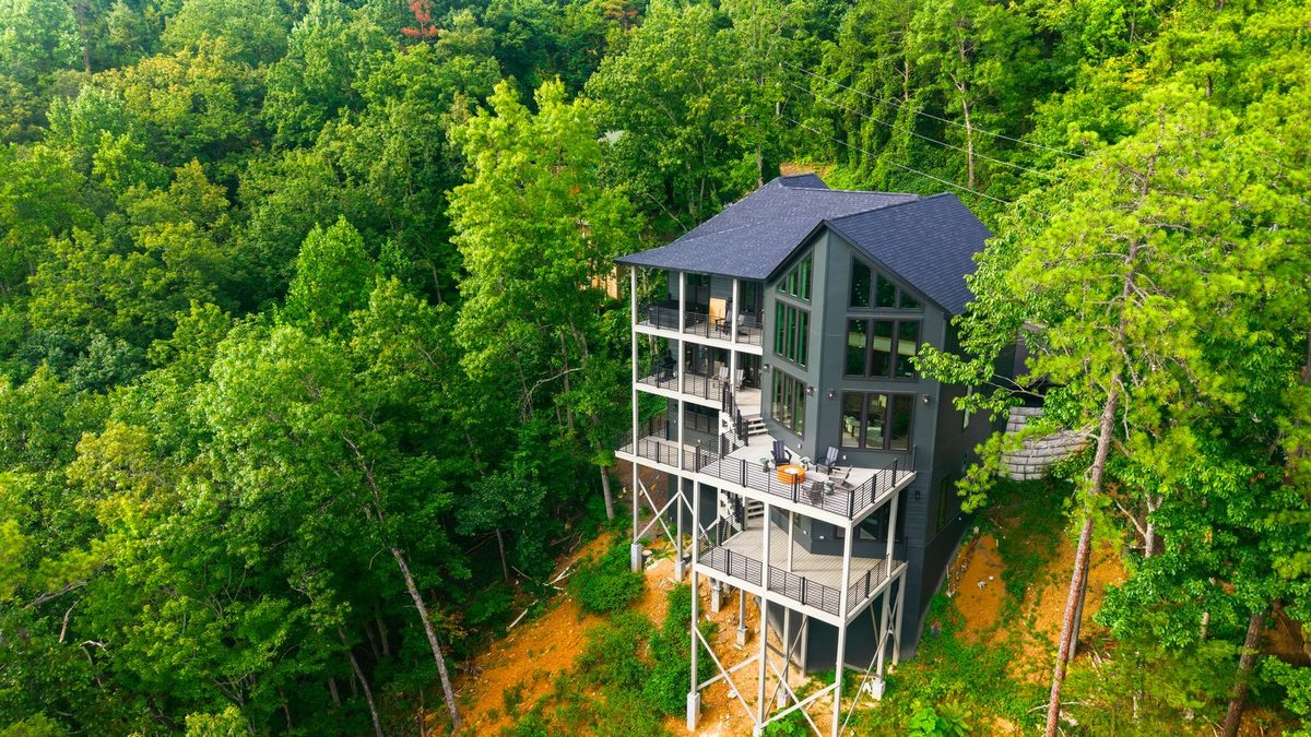 Aerial view of the home in the trees at 1813 Red Bone Way, Sevierville TN