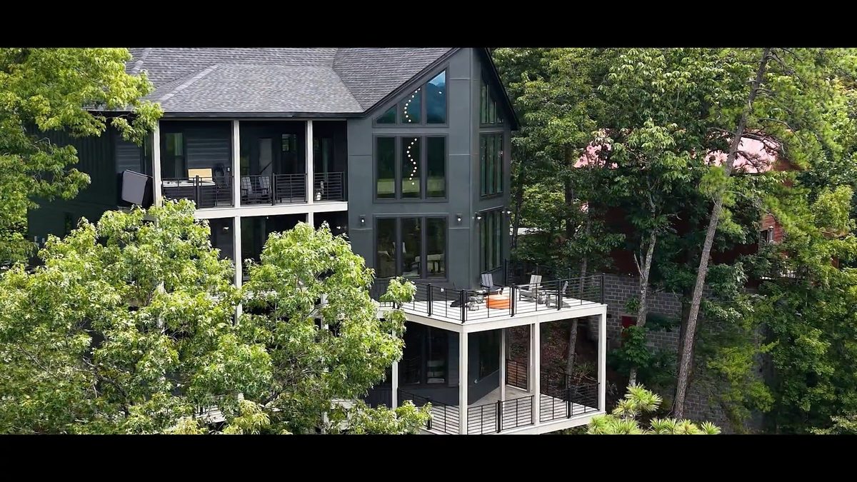 Film frame of a mountain home and deck in the trees, Sevierville TN